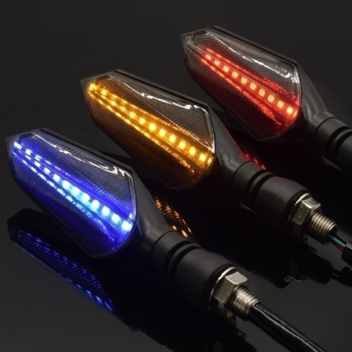 Four Universal Motorcycle LED Turn Signal Sequential Flow providing safety features and sequential flow on a sleek black surface.