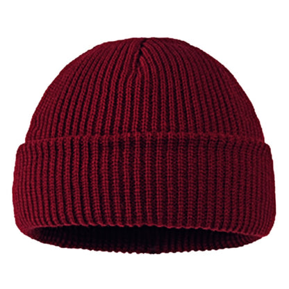 A wool knitted skull cap beanie on a white background, perfect for winter.