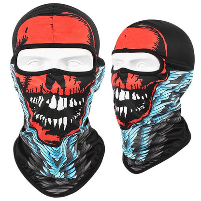 A Skull Balaclava Full Face Mask featuring a red and black skull design with white teeth and blue accents, ideal for skiing, snowboarding, or motorcycle rides. Shown from front and side views.