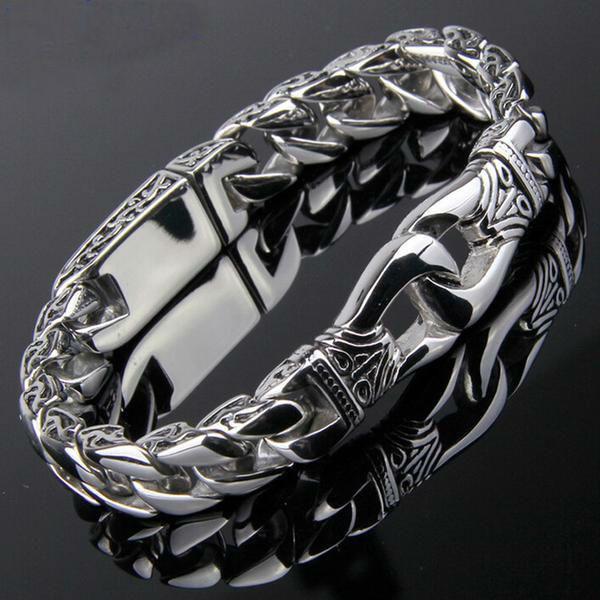A Stainless Steel Vintage Charm Bracelet for Bikers with an ornate design.