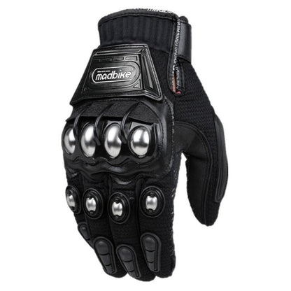 Motorcycle rider wearing Madbike gloves, gripping the handlebars.