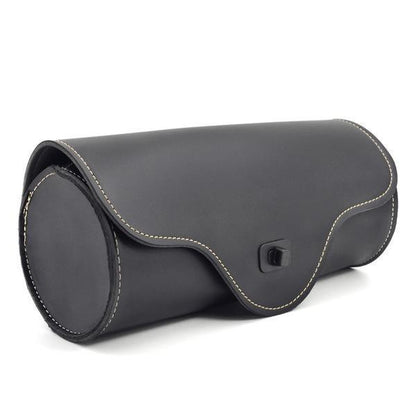 Black skull-shaped round saddle bag for a motorcycle.