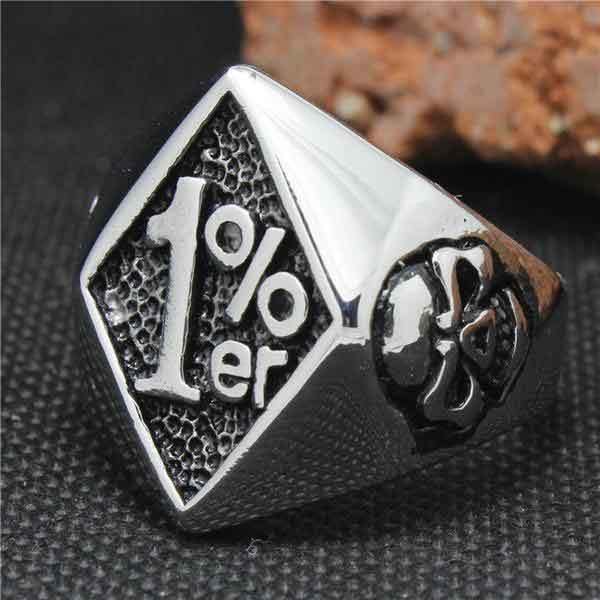 A silver 1%ER Man Ring with a diamond on it.