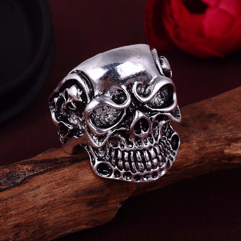 A Punk Ring on top of a piece of wood.